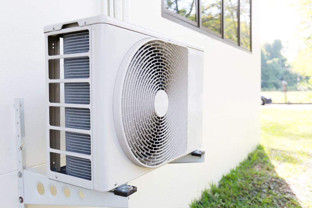 A White Air Conditioner is Mounted on the Side of a Building, Enterprise Air That's Cool in Pine Creek, QLD