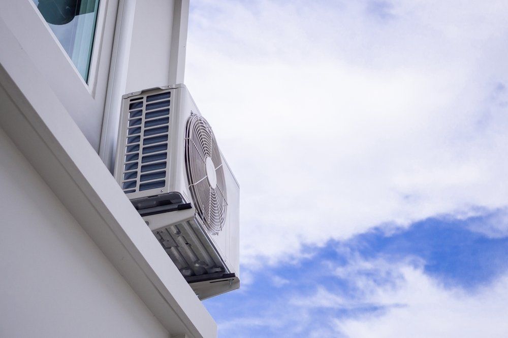 An Air Conditioner is Mounted on the Side of a Building, Enterprise Air That's Cool in Avoca, QLD