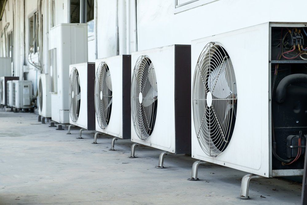 A Row of Air Conditioners Are Lined Up Outside of a Building, Enterprise Air That's Cool in Kepnock, QLD