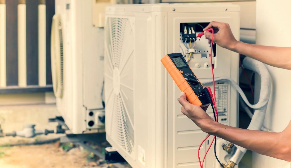 A Man is Using a Multimeter to Test an Air Conditioner, Enterprise Air That's Cool in Bullyard, QLD