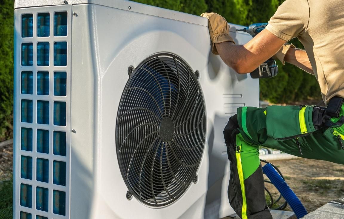 A Man is Installing an Air Conditioner With a Drill, Enterprise Air That's Cool in North Gregory, QLD