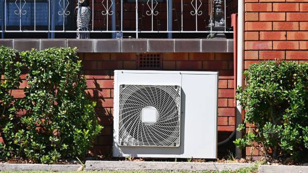 A White Air Conditioner is Sitting on the Side of a Brick Building, Enterprise Air That's Cool in Avenell Heights, QLD